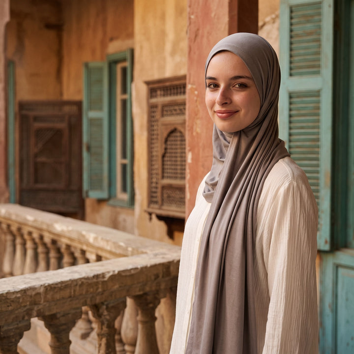 Stone grey instant hijab worn on a sunlit balcony in old Cairo